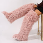 Blush pink shaggy over-the-knee boots with long fur fibers