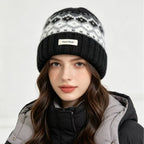 Women’s knit beanie with Fair Isle pattern and ribbed cuff, black with white and gray motifs