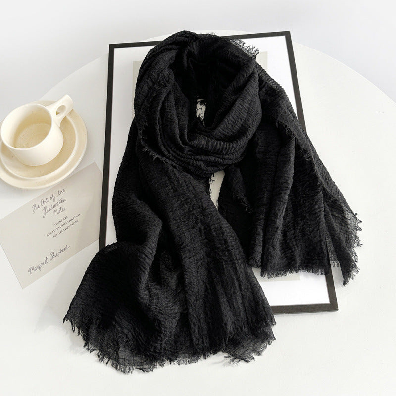 Women’s cotton scarf in black, long crinkle gauze with frayed fringe ends