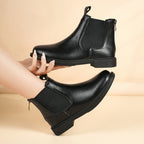 Women’s black Chelsea boots with elastic gore and pull tabs, low block heel