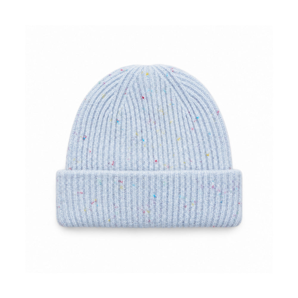 Speckled light blue rib-knit beanie with a wide folded cuff.