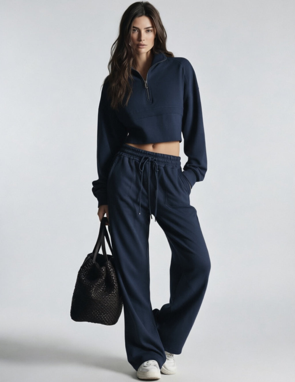 Navy women's sweatsuit with cropped half-zip sweatshirt and wide-leg drawstring pants