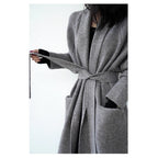 Gray long knit cardigan with shawl collar, belt tie, and patch pockets