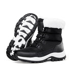 Black faux fur lined lace-up snow boots with rugged tread sole, side view.