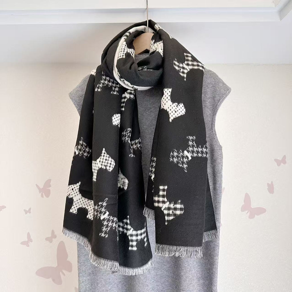 Black dog-print scarf with fringed ends, wrapped around a mannequin