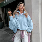 Light blue half-zip fleece pullover with oversized stand collar and long sleeves