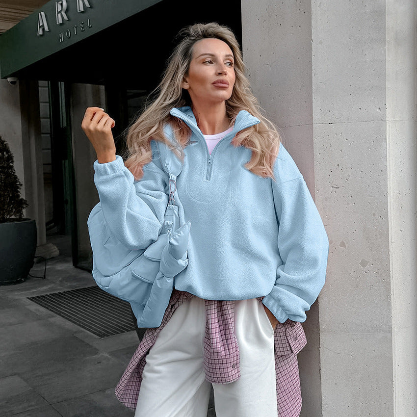 Light blue half-zip fleece pullover with oversized stand collar and long sleeves