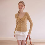 Tan knit cardigan with ruffle V-neck collar, button front, long sleeves