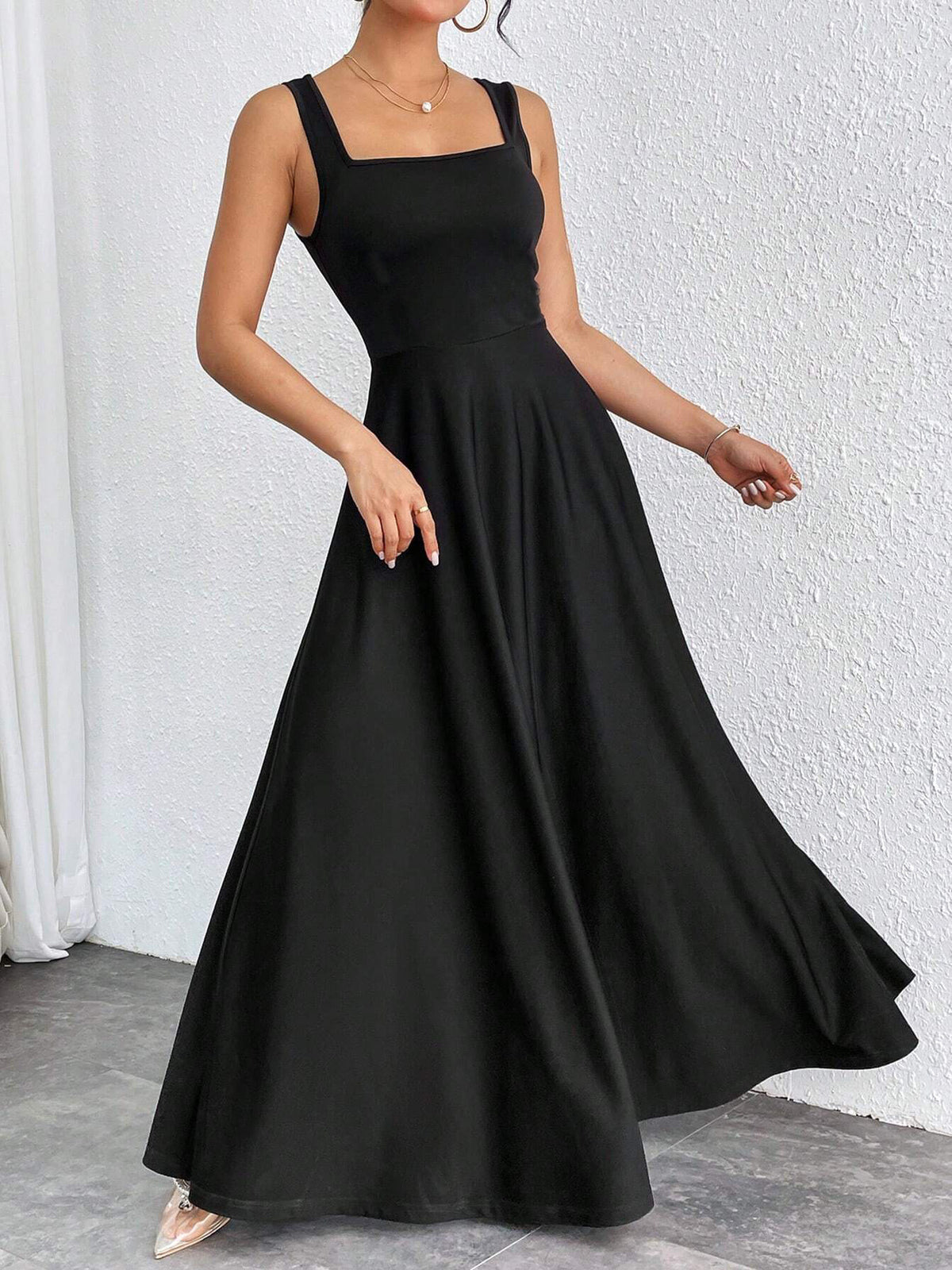 Black sleeveless square-neck maxi dress with pleated flared skirt