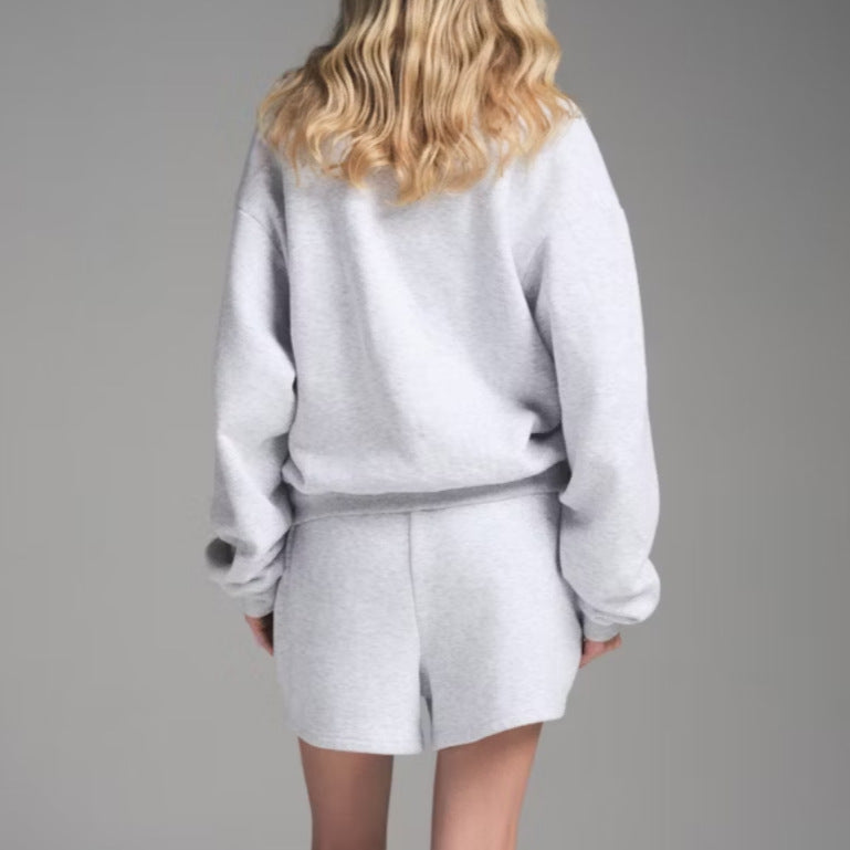 Light gray crew neck sweatshirt with matching drawstring shorts set, back view.