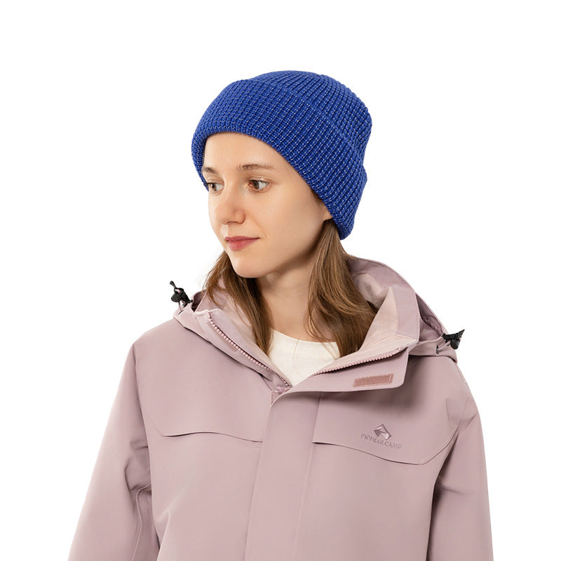 Women’s fisherman beanie in blue reflective waffle-knit with cuff, worn on model