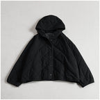 Women’s quilted hooded jacket, black button front with diamond quilting and long sleeves