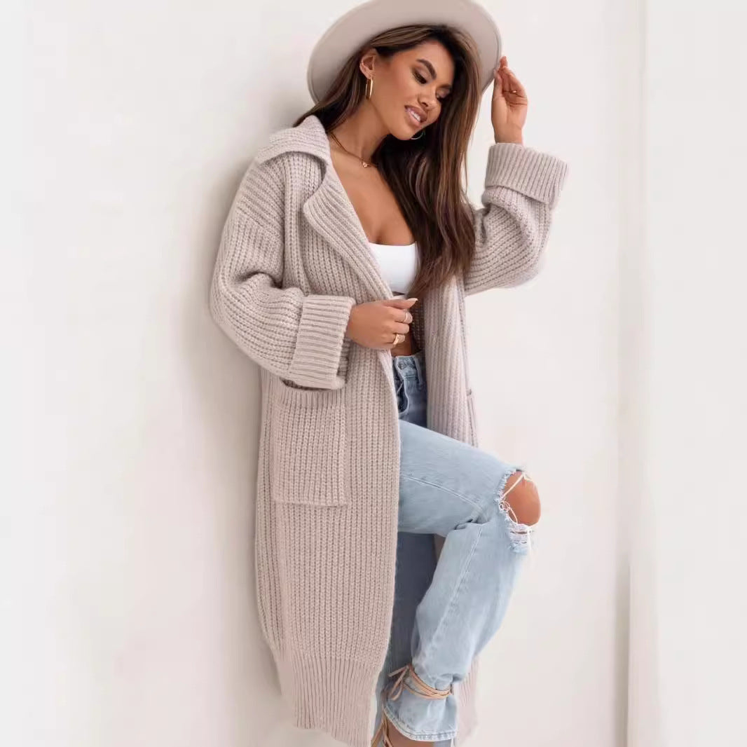 Beige long duster cardigan, chunky ribbed knit texture, notched collar, side pockets