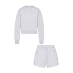 Light gray crew neck sweatshirt and matching drawstring shorts, two-piece lounge set.