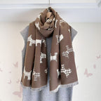 Brown dog-print scarf with fringed ends, wrapped around a mannequin