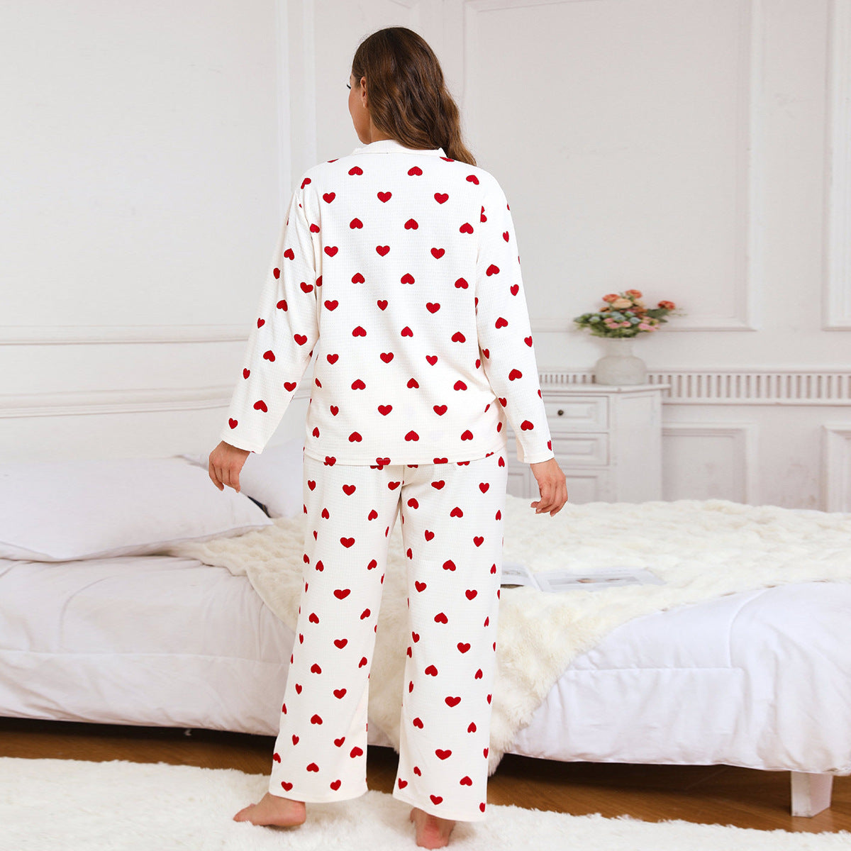Women’s heart-print pajama set, back view with red heart pattern on white top and pants