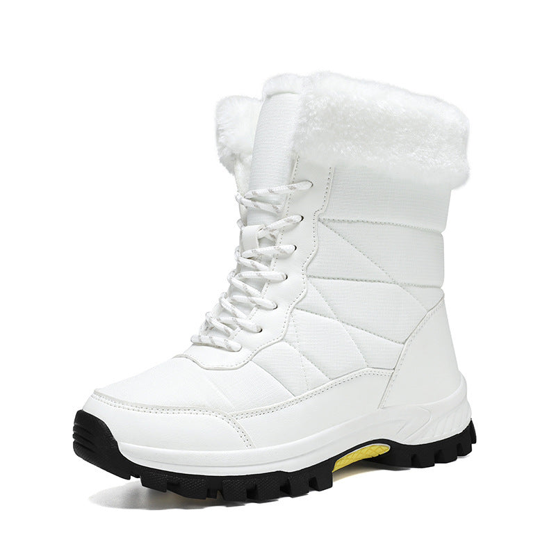 Women’s mid-calf faux fur snow boot in white with quilted upper and lace-up front