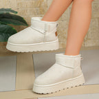 Women’s white short snow boots with ankle strap, thick sole, and soft fleece lining