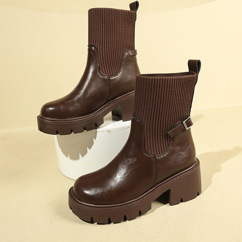 Dark brown sock boots with ribbed cuffs, buckle strap, and lug sole