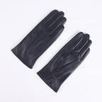 Women's dark leather winter gloves pair, fleece-lined, three-panel stitched design