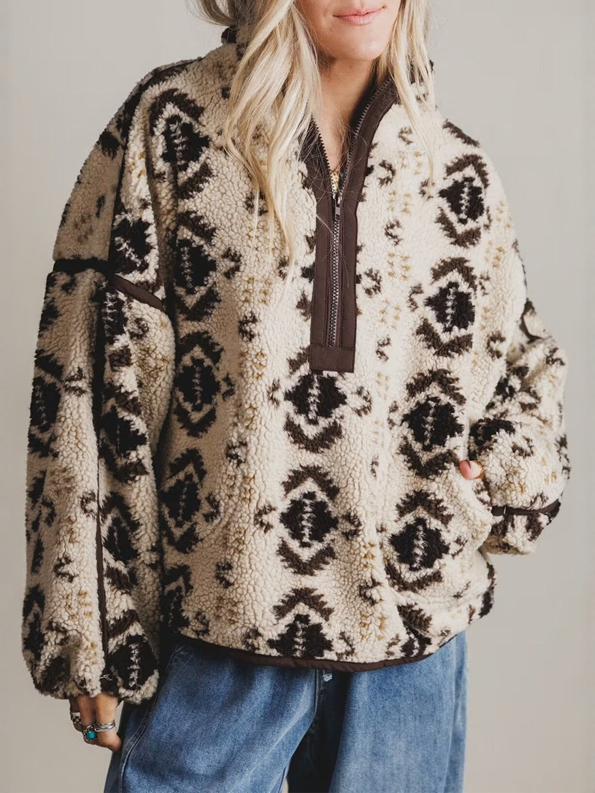 Women's cream sherpa pullover with quarter-zip, aztec pattern, long sleeves, pocket