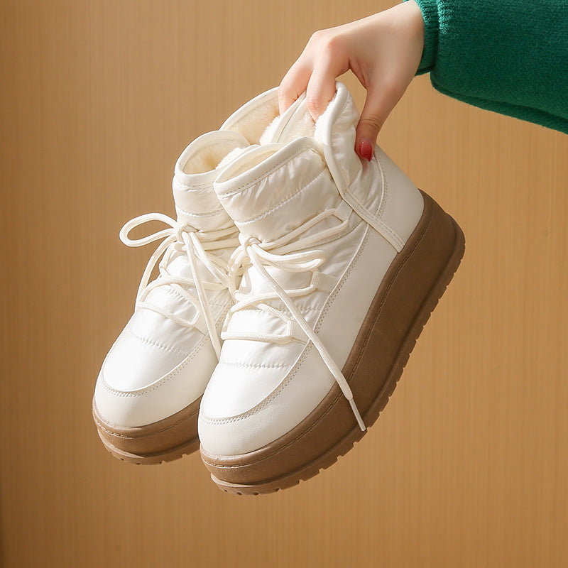 Fleece-lined lace-up snow boots in white with padded ankle collar and platform sole