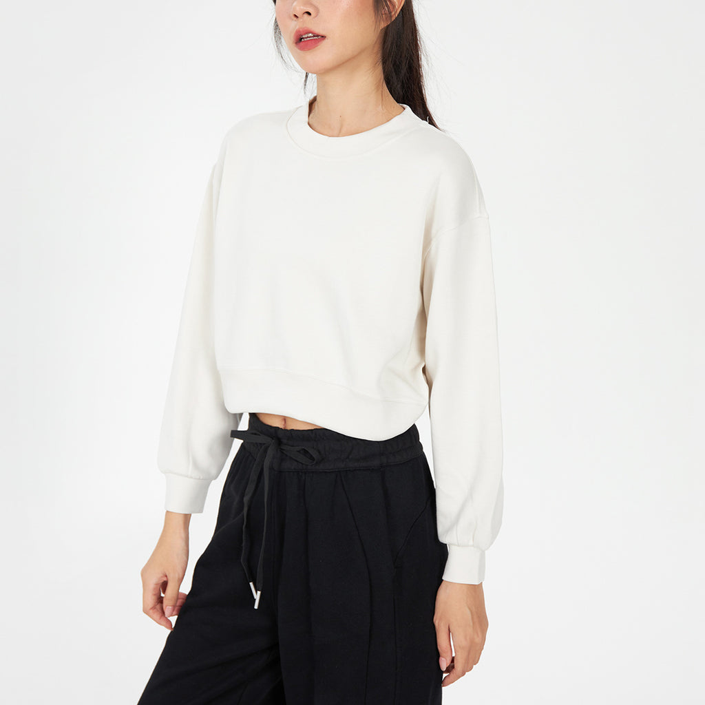 Off-white cropped crewneck sweatshirt with oversized long sleeves and ribbed cuffs