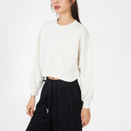 Off-white cropped crewneck sweatshirt with oversized long sleeves and ribbed cuffs