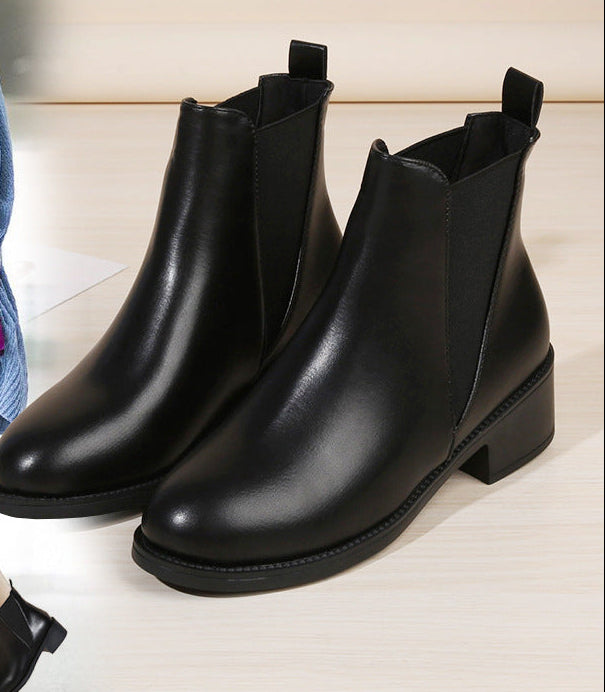 Black chelsea ankle boots with chunky block heel, round toe, pull-on style