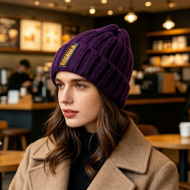 Chunky ribbed beanie in deep purple with folded cuff and letter patch