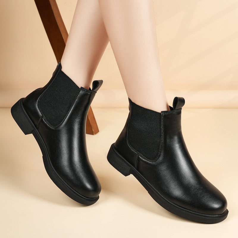 Women’s black Chelsea boots with elastic side panels and low block heel