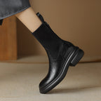 Women's black leather sock boots with ribbed knit shaft and chunky molded sole