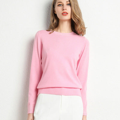 Pink women's crew neck fine-knit sweater with ribbed cuffs and hem