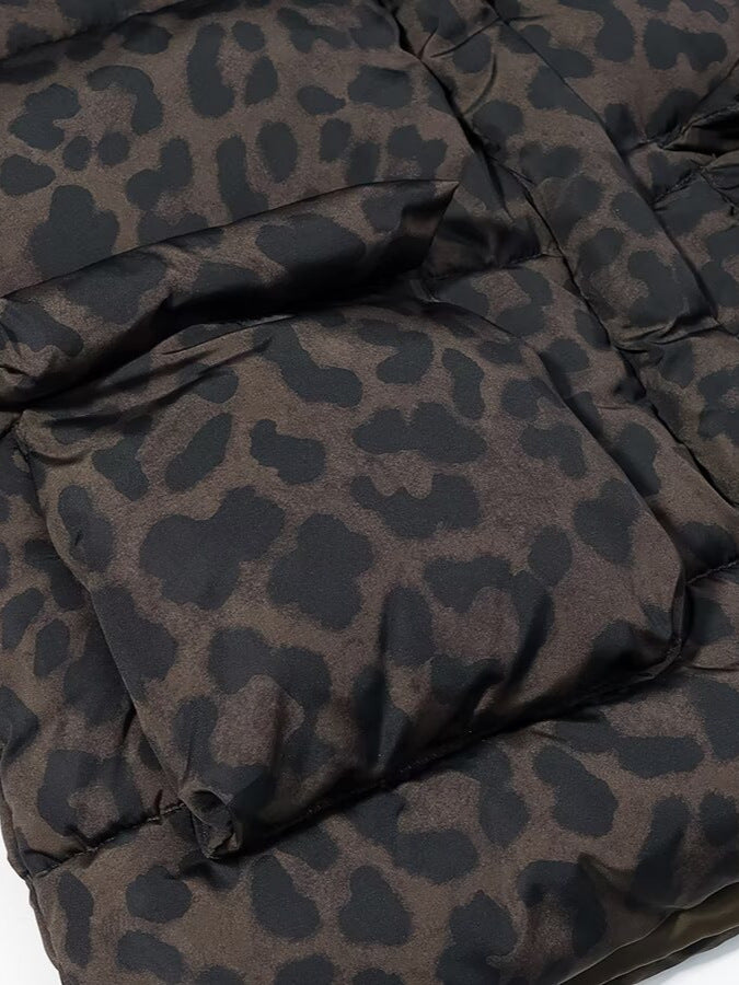 Leopard print puffer jacket close-up showing quilted panels and gathered fabric