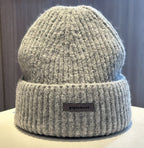 Light gray ribbed knit beanie with wide cuff and woven "pipiswoot" label