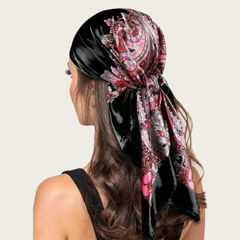 Large satin square scarf in black with pink paisley print, tied head wrap