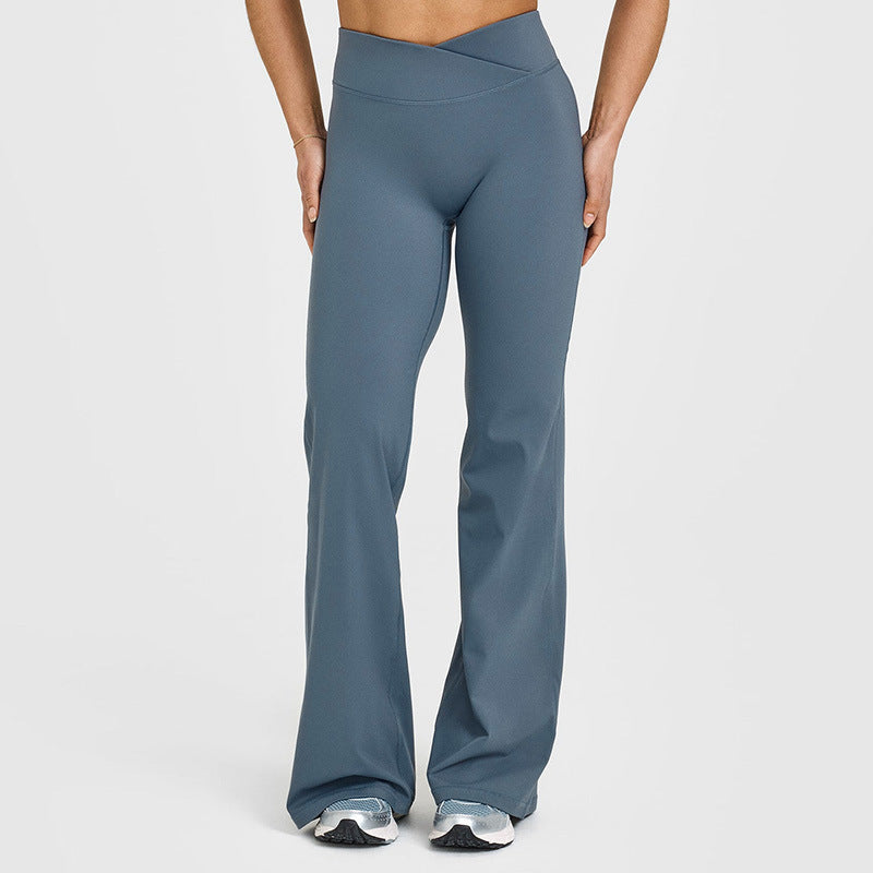 Women’s high-waisted crossover flare leggings in slate blue, V-shaped waist seam