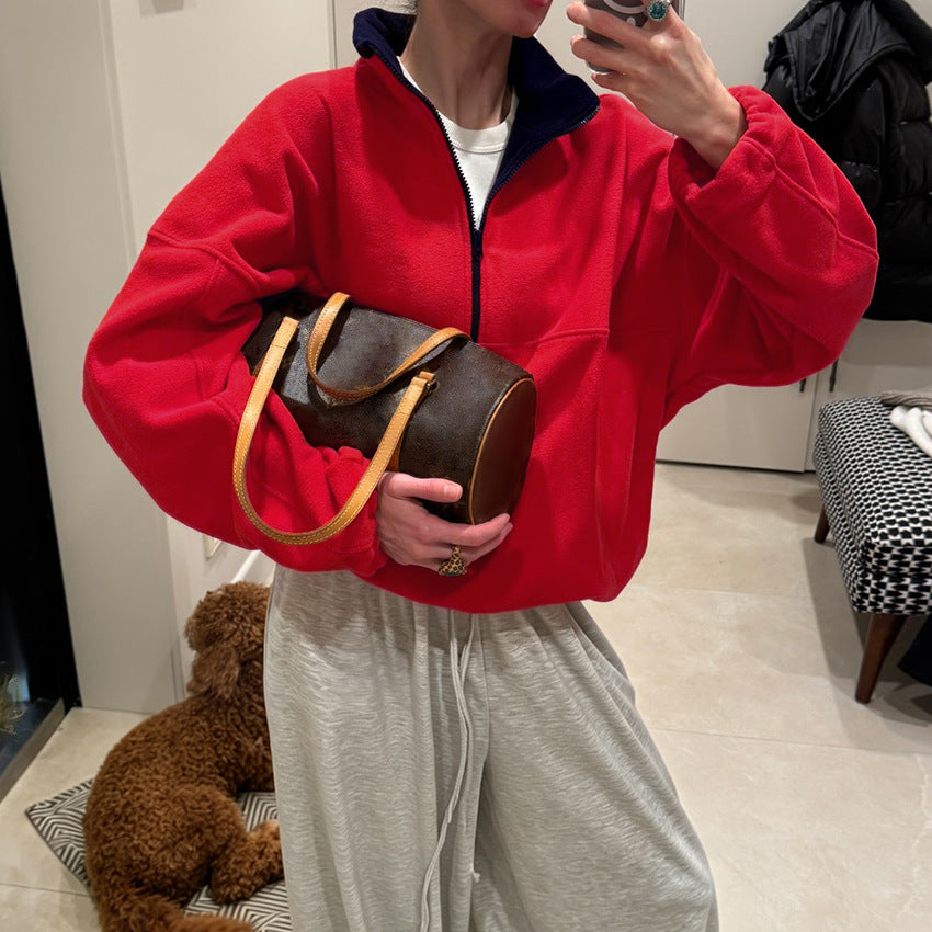 Red half-zip fleece pullover with oversized stand collar and long sleeves