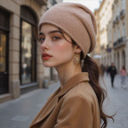 Women’s knitted beanie hat in light taupe, folded cuff and soft knit texture.