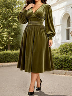 Green velvet midi dress with long sleeves, V-neck, ruched waist fit-and-flare