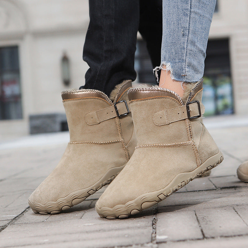 Women's winter boots, tan suede with buckle strap, faux fur trim, textured non-slip sole.