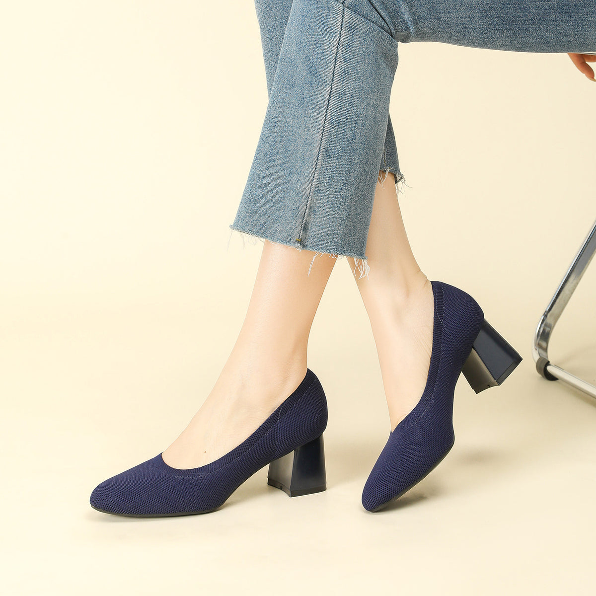 Navy knit block heel slip-on pumps with rounded toe and textured upper