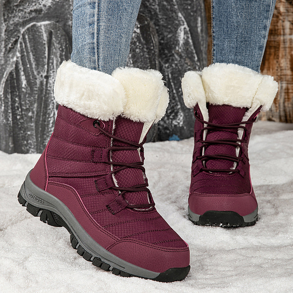 Women’s burgundy lace-up snow boots with faux-fur cuffs and lug rubber sole