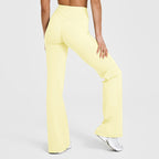 Women’s high-waisted crossover flare leggings in pale yellow, wide bootcut pant legs