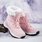 Women’s pink faux fur lined lace-up snow boots with high cuff and lug sole.