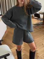 Women’s oversized gray knit pullover and matching drawstring shorts set, long sleeves