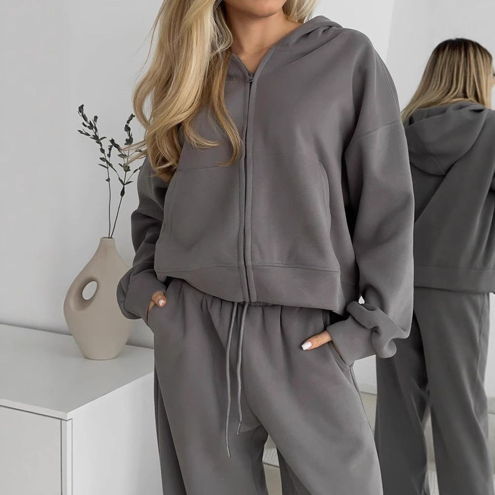 Women’s gray zip-up hoodie with drawstring waist sweatpants set in soft fleece.