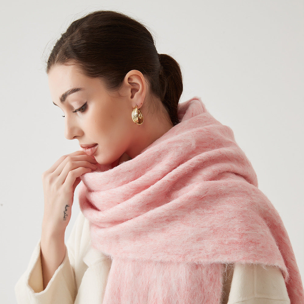 Oversized fuzzy mohair-blend scarf with fringe ends, light pink, worn draped over shoulders