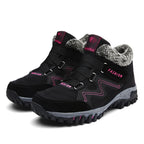 Black snow boots with faux fur lining, hook-and-loop straps, grippy lug sole