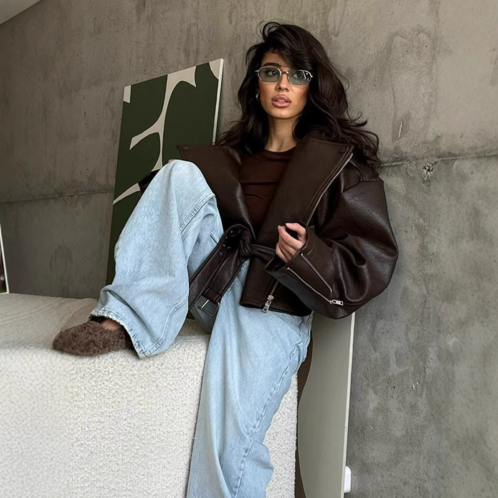 Brown oversized moto jacket with wide lapels and belted waist